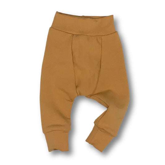 Gusseted long baby pants in a warm toast color