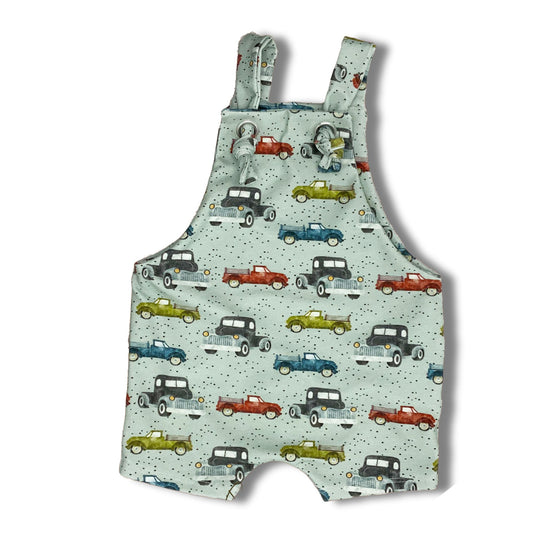 Short summer romper featuring vintage cars and trucks on a light grey background